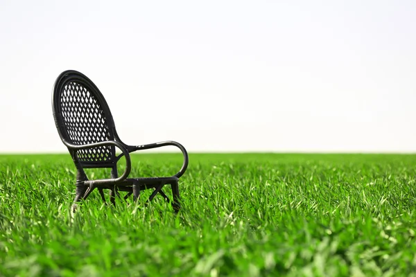 Black chair on field — Stock Photo, Image
