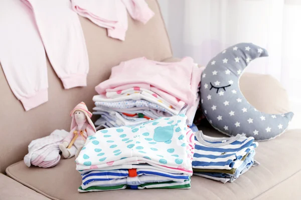 Baby linen on sofa — Stock Photo, Image
