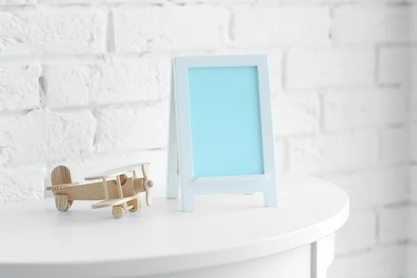 Baby toy and frame — Stock Photo, Image
