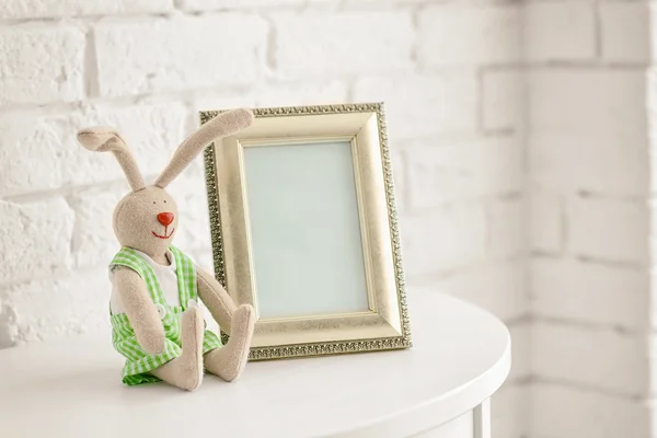 Baby toy and frame — Stock Photo, Image
