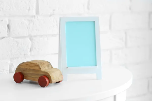 Baby toy and frame — Stock Photo, Image