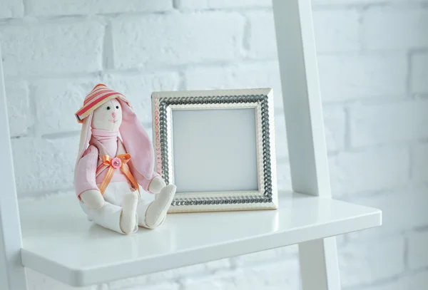 Baby toy and frame — Stock Photo, Image