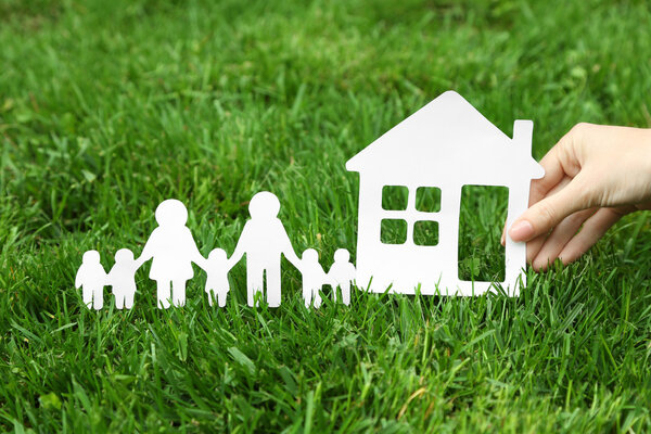 Woman hand holding family shape