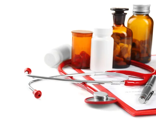 Red stethoscope and pills — Stock Photo, Image