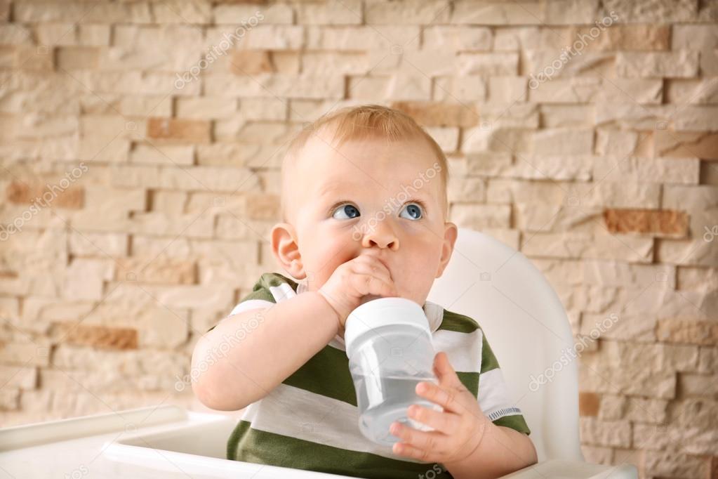 Baby drinking water Stock Photo by ©belchonock 113566494