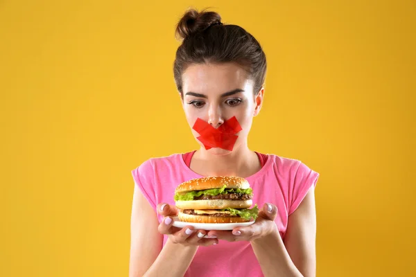 Woman with tied mouth — Stock Photo, Image