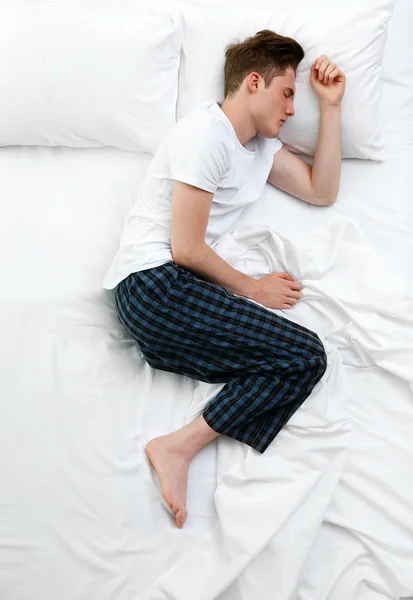 Handsome man in bed — Stock Photo, Image