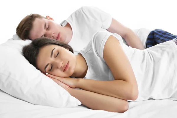 Para w łóżku, na białym tle — Zdjęcie stockowe