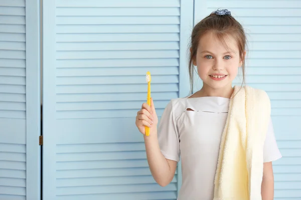 Cute girl with toothbrush — Stock Photo, Image
