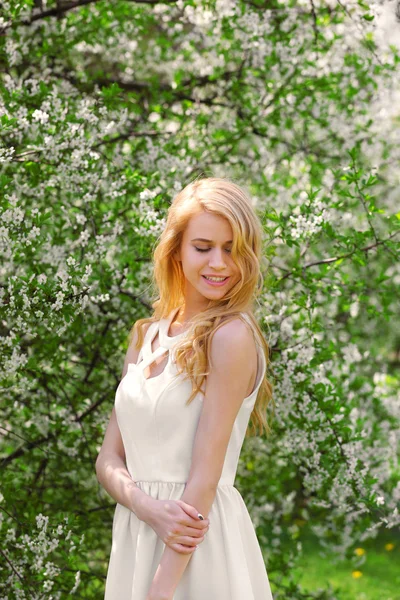 Woman on blooming tree background — Stock Photo, Image