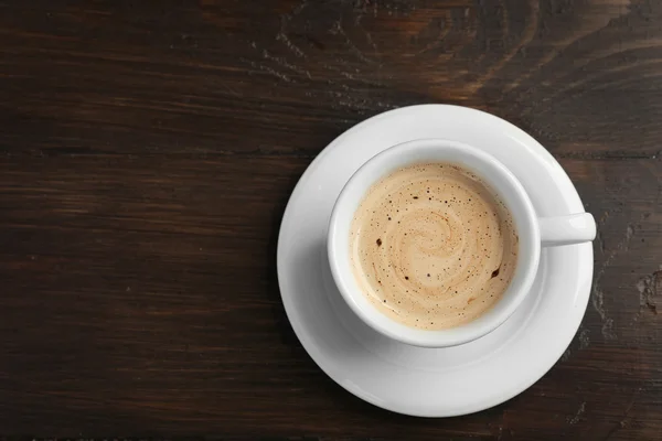 Cangkir kopi di latar belakang — Stok Foto