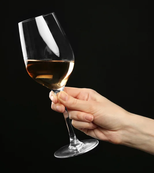 Female hand holding glass of champagne — Stock Photo, Image