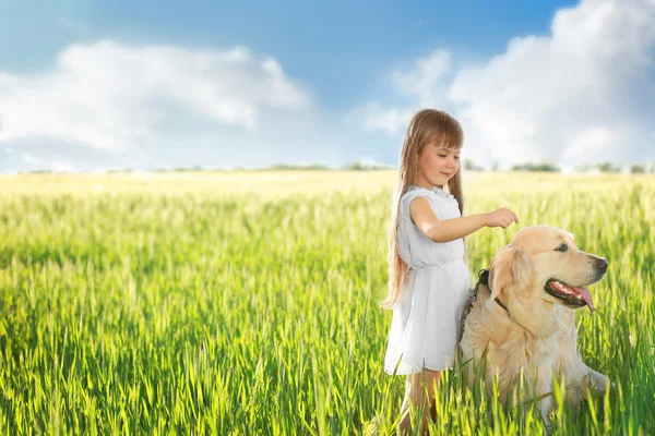 Little girl and big kind dog — Stock Photo, Image