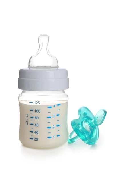 Baby milk bottle and pacifier — Stock Photo, Image