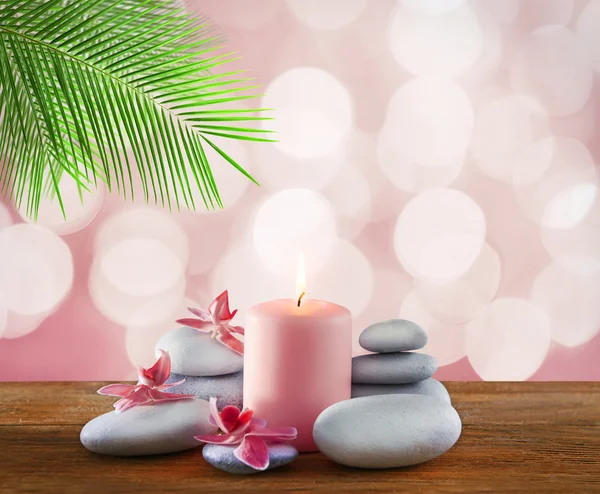 Spa stones with candle and flowers — Stock Photo, Image