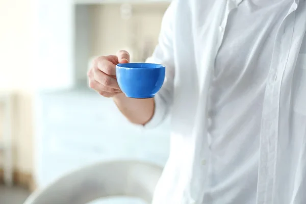 Handsome man with cup of coffee — Stock Photo, Image