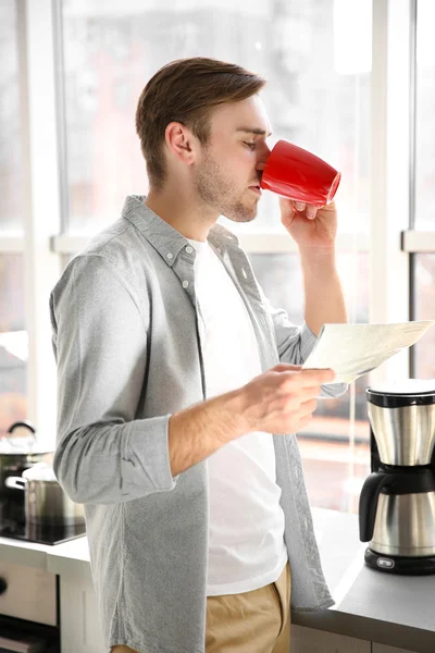 Handsome man with cup of coffee — Stock Photo, Image