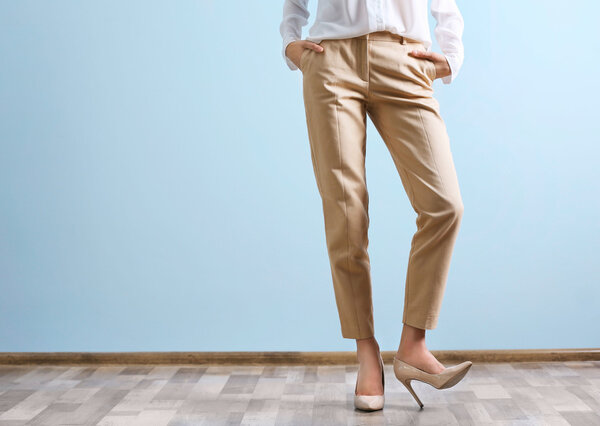woman in a white shirt and beige pants