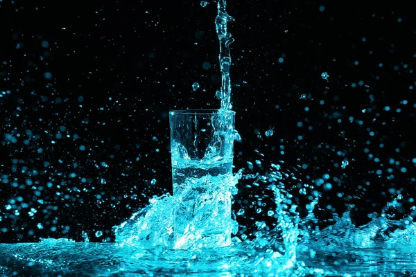 Pouring water into glass — Stock Photo, Image