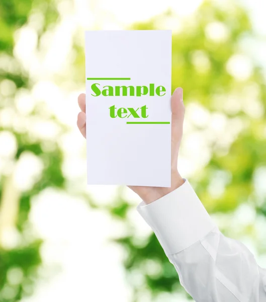 Male hand with white paper — Stock Photo, Image