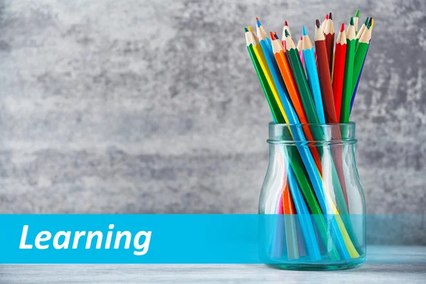 Pencils in glass jar — Stock Photo, Image