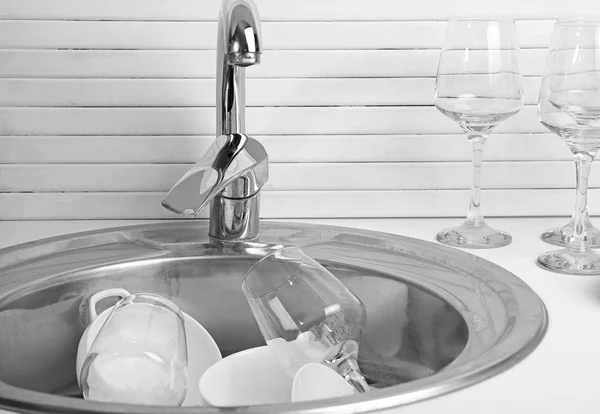 Pile of dishes in sink — Stock Photo, Image