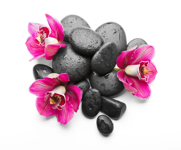 Piedras de spa y orquídea roja — Foto de Stock