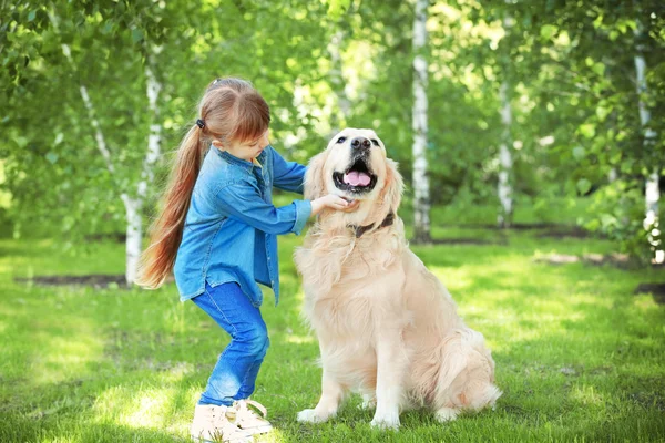 Little girl and big kind dog — Stock Photo, Image