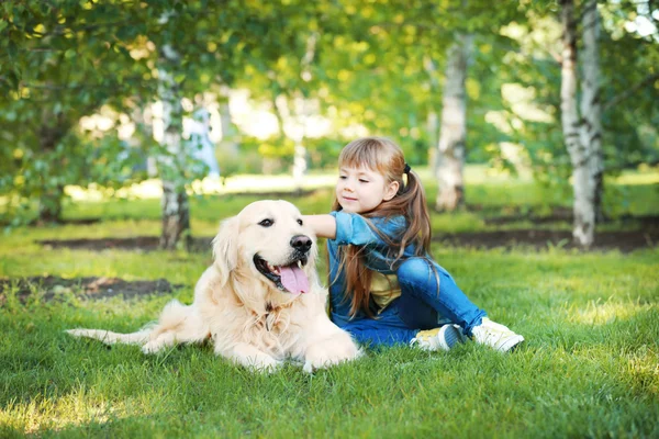 Little girl and big kind dog