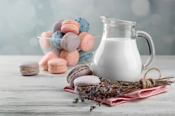 Tasty macaroons with milk — Stock Photo, Image