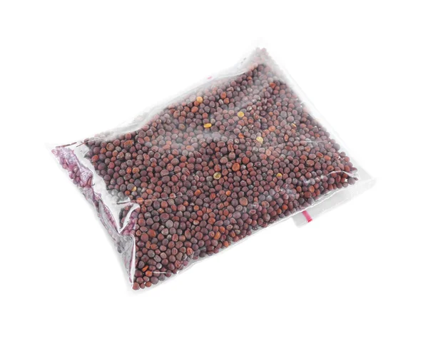Black mustard seeds in plastic zipper bag, — Stock Photo, Image