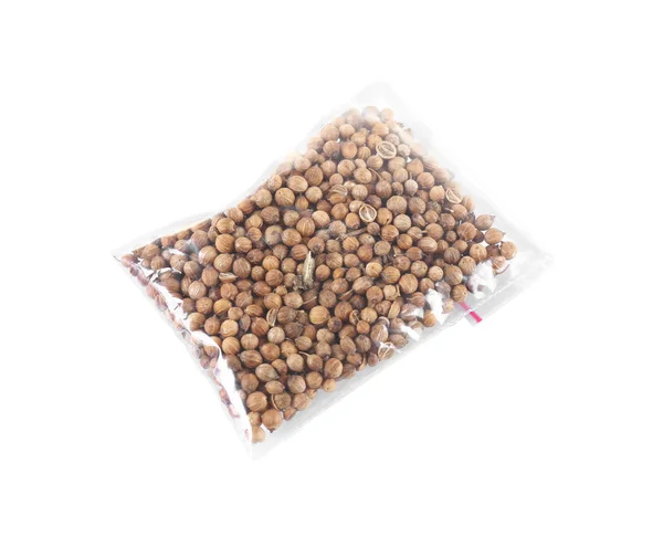 Coriander seeds in plastic zipper bag — Stock Photo, Image