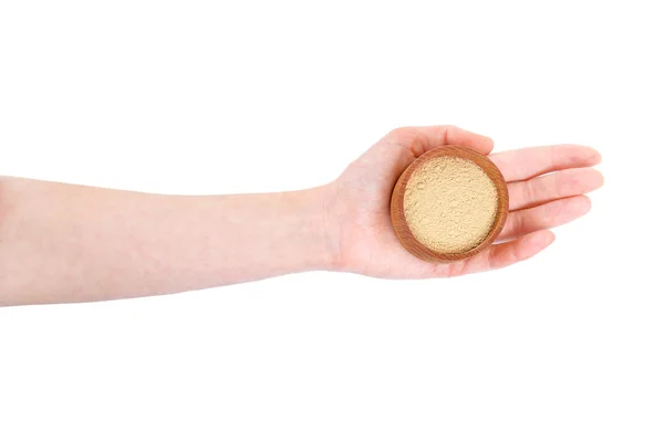 Hand holding bowl with powdered ginger — Stock Photo, Image