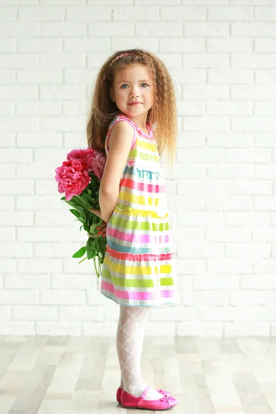 Beautiful girl holding  peonies bouquet — Stock Photo, Image