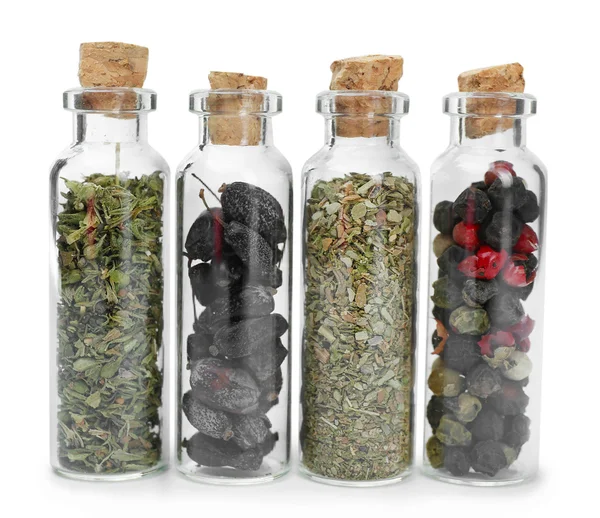 Surtido de especias secas en botellas de vidrio — Foto de Stock