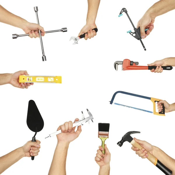 Mãos segurando diferentes objetos isolados — Fotografia de Stock