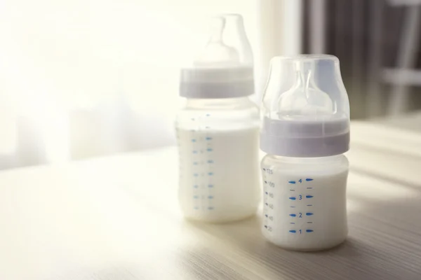Baby bottles with milk — Stock Photo, Image