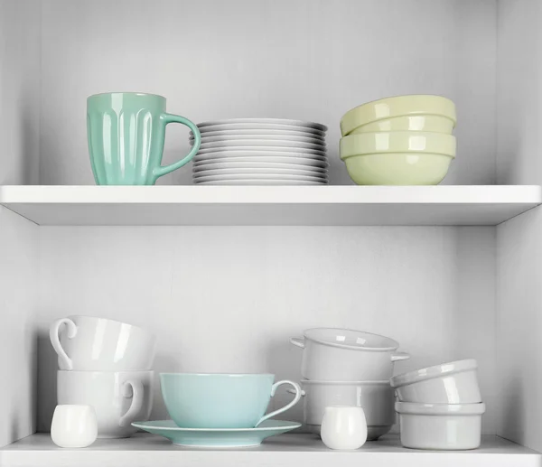 Dishes in cupboard in the kitchen — Stock Photo, Image