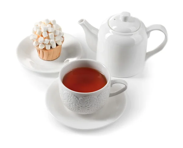 Taza de té con sabroso cupcake — Foto de Stock