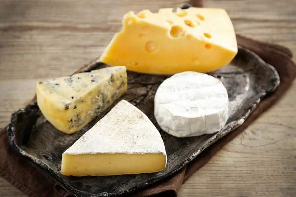 Cheese on tray on table — Stock Photo, Image