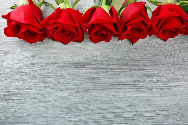 Red roses on wooden — Stock Photo, Image