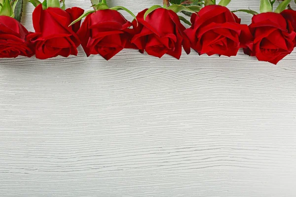 Red roses on wooden — Stock Photo, Image