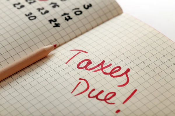 Tax day reminder in a notebook — Stock Photo, Image