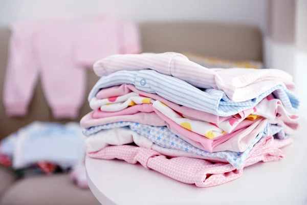 Baby linen on table — Stock Photo, Image