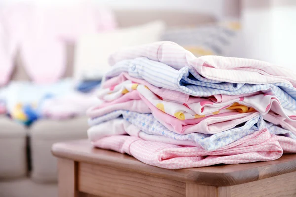 Baby linen on table — Stock Photo, Image