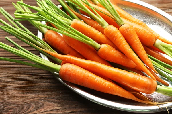 Carrots on metal plate — Stock Photo, Image