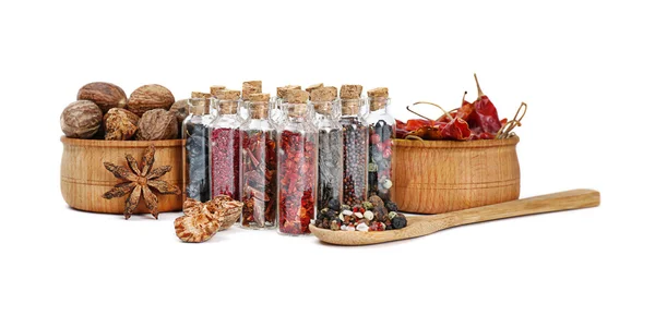 Assorted dry spices in glass bottles — Stock Photo, Image
