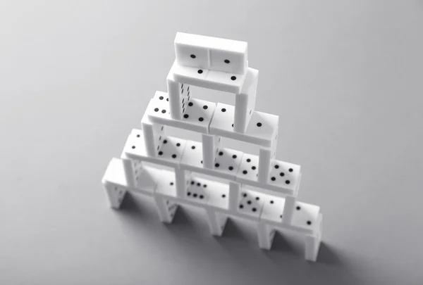 Tower of dominoes on  background — Stock Photo, Image