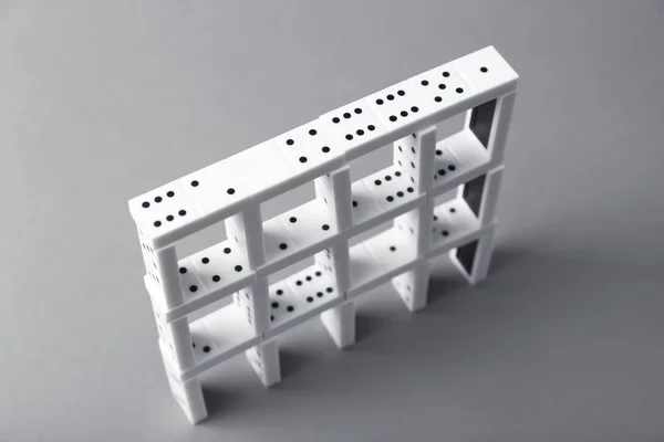 Tower of dominoes on  background — Stock Photo, Image