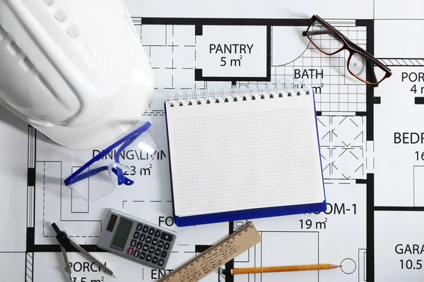 Construction drawing with tools — Stock Photo, Image